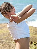 Catching rays always smiling, her youthful exuberance and cheerful demeanor is highly engaging as she plays and have fun at the rocky beach.