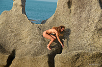 On the rocks 1 sarka flaunts her naked body and poses playfully on rugged rocks and desolate beach on her background.