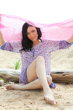 Presenting anja b anja b enjoys showcasing her lean, slender body on the sandy beach.