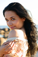At the beach 1 beautiful olka, strips her flowery top with white skirt as she delightfully displays her slender, nubile body at the beach.