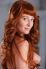 Show off 2 oxavia showcasing her sexy physique with beautiful breasts as she bares her untrimmed pussy on the bed.