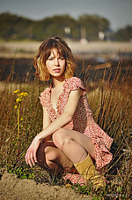 After the burn emily windsor flaunts her petite body with unshaven pussy as she poses on the field.