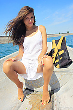 Presenting salomja a salomja a displays her wet, sexy body as she sensually poses in the river.