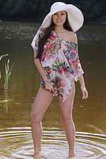 Presenting sila 1 sila delightfully poses by the river as she bares her slender, sexy body and tight butt.