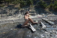 Summer swim katoa bares her nubile body as she playfully dips in the beach.