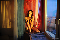 Presenting toni 1 newcomer toni sensually poses by the window as she waits for the sunset.