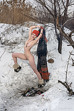 Presenting selin selin playfully poses in the snow as she displays her sweet pussy.