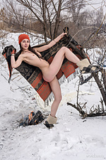 Presenting selin selin playfully poses in the snow as she displays her sweet pussy.