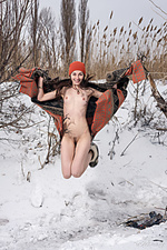 Presenting selin selin playfully poses in the snow as she displays her sweet pussy.