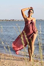 Presenting lusee lusee shows off her luscious body as she poses by the lake.