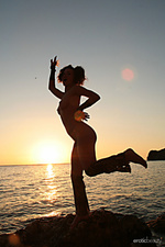 Having fun firebird a bares her gorgeous physique as she playfully poses outdoors.