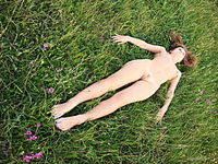 Rolling plains lili f  displays her naked, petite body as she delightfully poses in the fields.