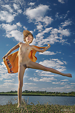 Flying high mak playfully poses by the lake as she flaunts her nubile body.