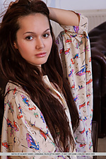 Sintia seductive brunette sintia starts taking off her clothes on top of the couch