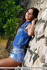 Aleksandrina newcomer aleksandrina poses against the stone wall baring her sexy curves.