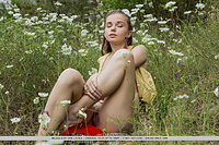 Milena d milena d bares her petite body as she sensually poses in the meadows.