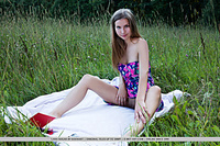 Lara sugar lara sugar strips her flowery dress on the grass as she flaunts her nubile body.
