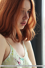 Riccarda alluring redhead riccarda displays her creamy body with pink nipples on the bed.