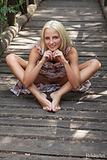 Suvel alysha's amazing beauty stands out as she frolics in the outdoor in her floral dress, her long blonde hair framing her pretty face with stunning blue eyes and charming smile. 