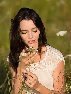 Lost in the meadow adel morel bares her petite body as she strips in the meadow.