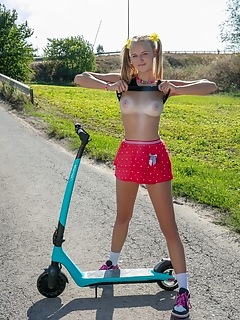 Nude teen on a scooter