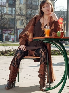 Public nudity red eva displays her slender body in the park.